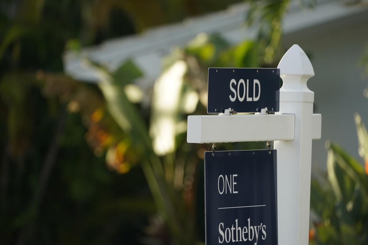 A sold sign is shown in front of a home, Monday, Sept. 20, 2021, in Surfside, Fla. Average long-term U.S. mortgage rates rose this week as the key 30-year loan vaulted over 4% for the first time since May 2019. Mortgage buyer Freddie Mac reports, Thursday, March 17, 2022, that the average rate on the 30-year loan this week jumped to 4.16% from 3.85% last week. (AP Photo/Wilfredo Lee)