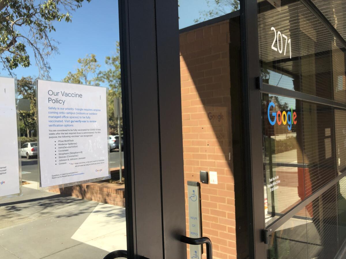 A vaccine policy posted on the door of a Google office in Mountain View.