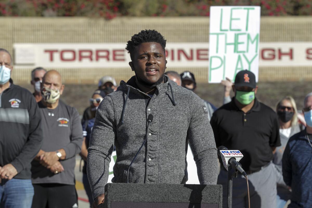 Westview High football player Mandela Tobin speaks during a sports rally Friday at Torrey Pines High.