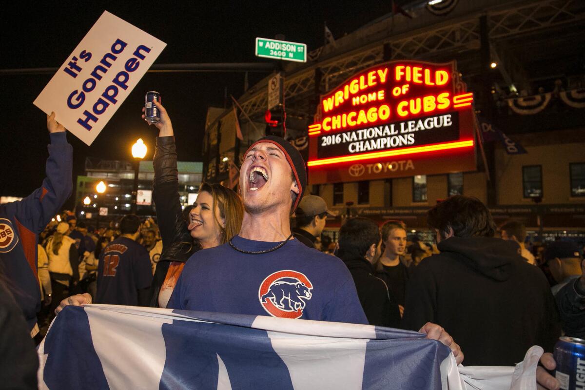 Cubs fans celebrate outside Wrigley Field after the Cubs defeated the Dodgers in the National League Championship Series. Will they soon be celebrating a World Series title as well?