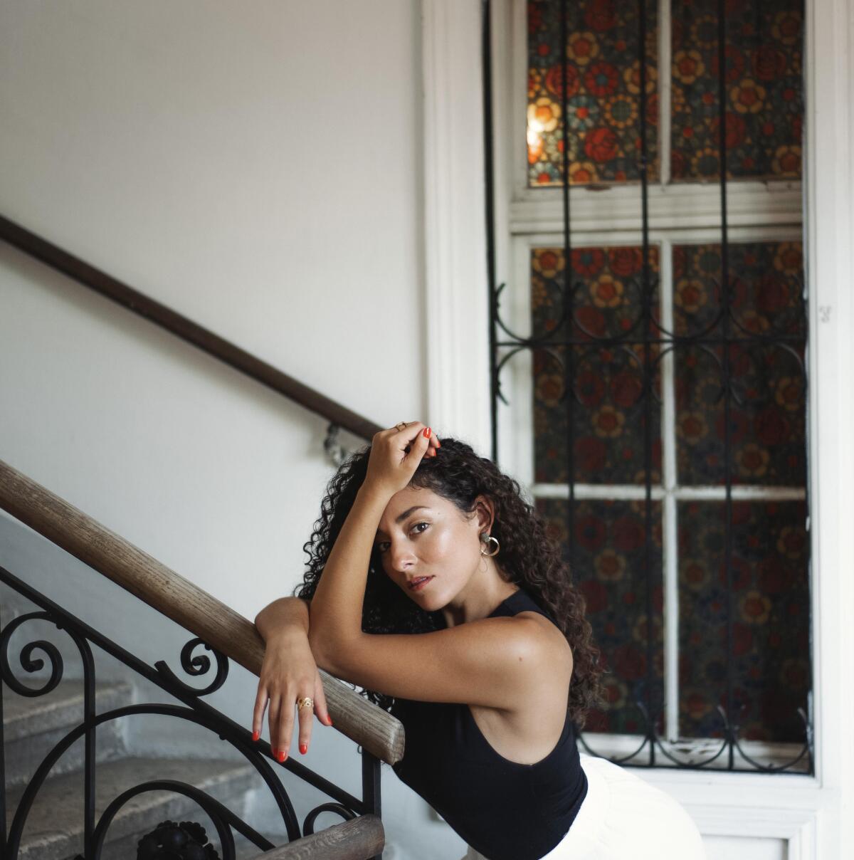 American opera soprano Andrea Carroll photographed in a  stairwell.