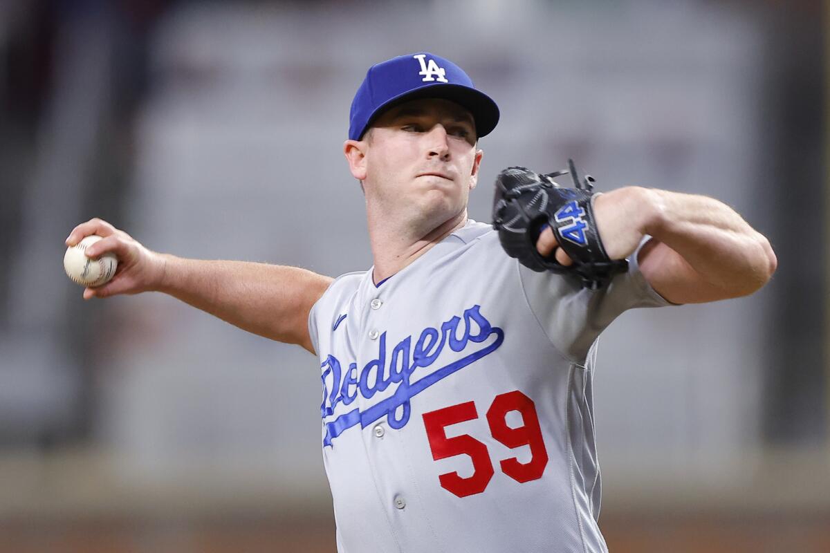 Dodgers reliever Evan Phillips works against the Atlanta Braves at Truist Park on May 23, 2023 in Atlanta.