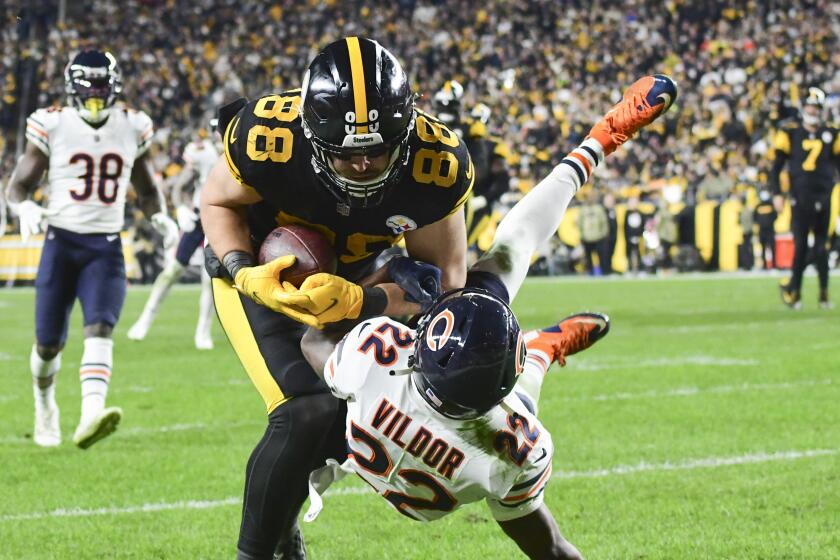 Pittsburgh Steelers tight end Pat Freiermuth (88) makes a catch for a touchdown as Chicago Bears cornerback Kindle Vildor (22) defends during the second half of an NFL football game, Monday, Nov. 8, 2021, in Pittsburgh. (AP Photo/Fred Vuich)