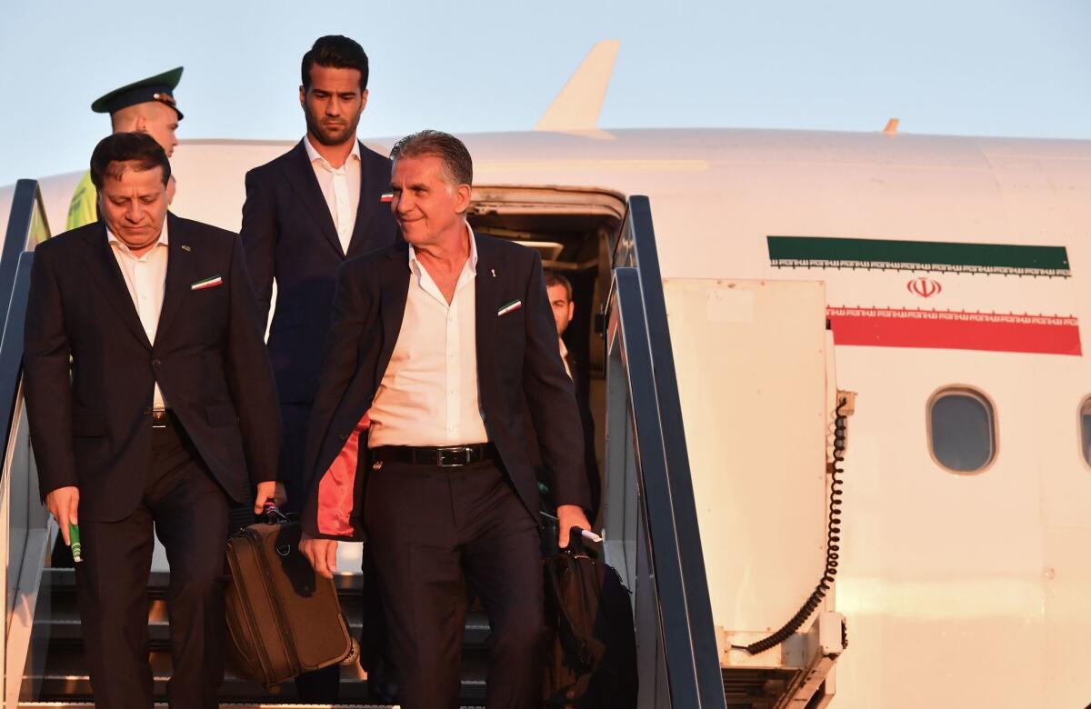 Iran's national football team Portuguese coach Carlos Queiroz and his footballers arrive at Moscow's Vnukovo airport on June 5, 2018, to take part in the 2018 FIFA World Cup football tournament in Russia.