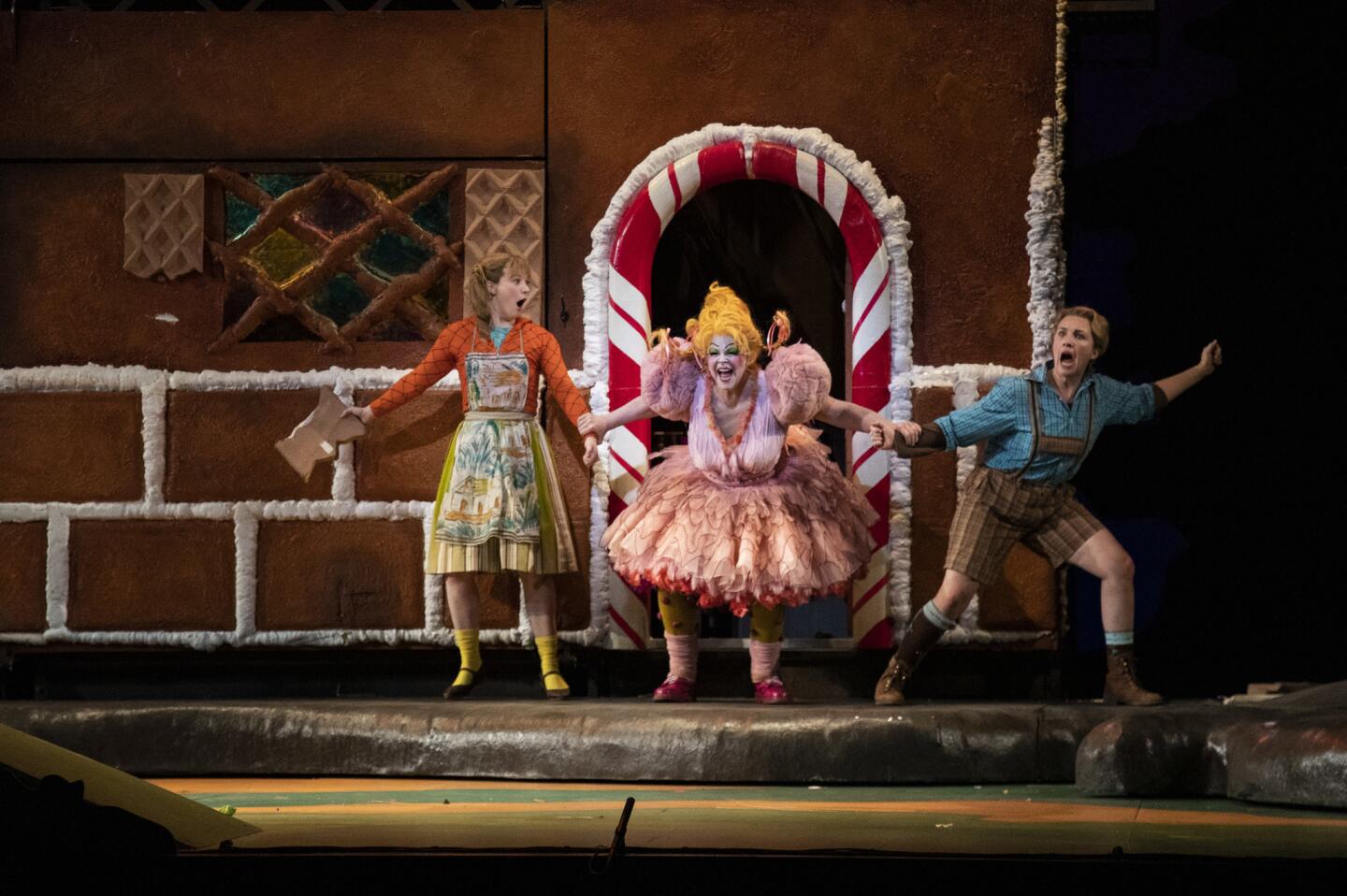 Hansel and Gretel, played by Sasha Cooke and Liv Redpath, are grabbed by the wicked witch, played by Susan Graham, at the Dorothy Chandler Pavilion in Los Angeles on Nov. 15, 2018.