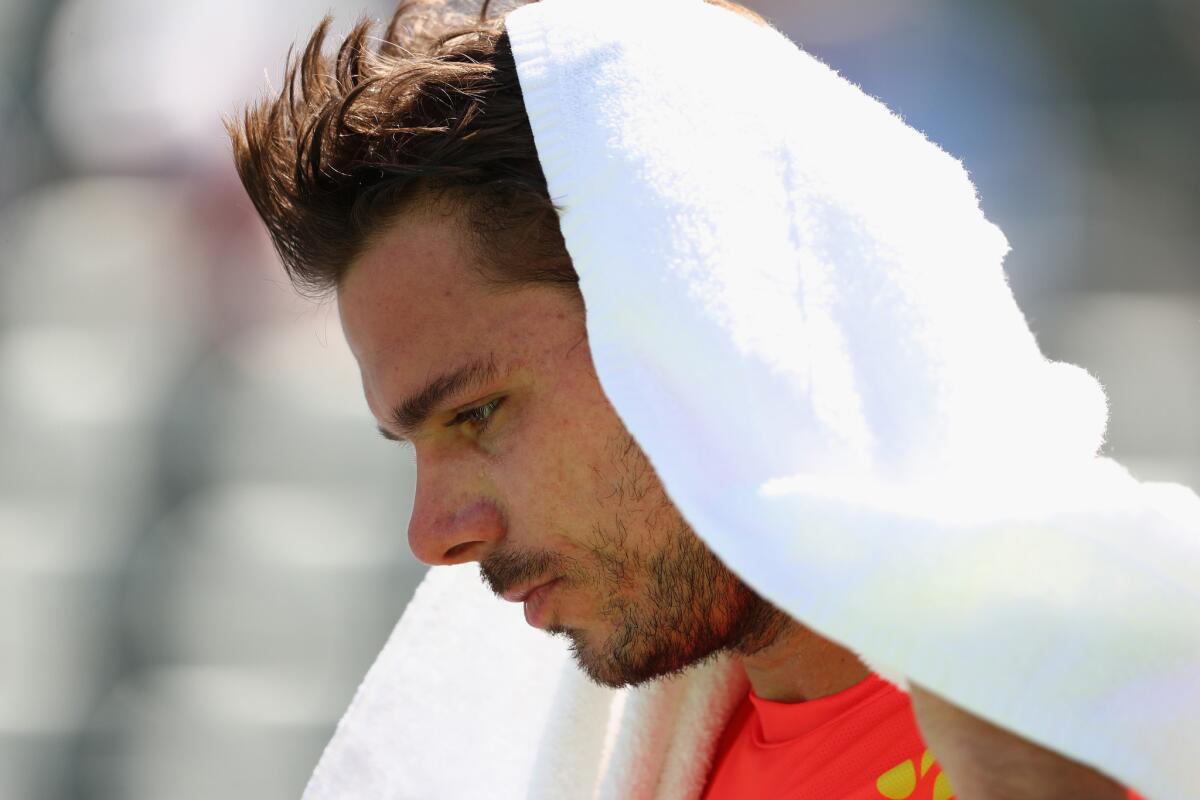 Stan Wawrinka of Switzerland looks down during his fourth-round match against David Goffin of Belgium at the BNP Paribas Open on March 16.