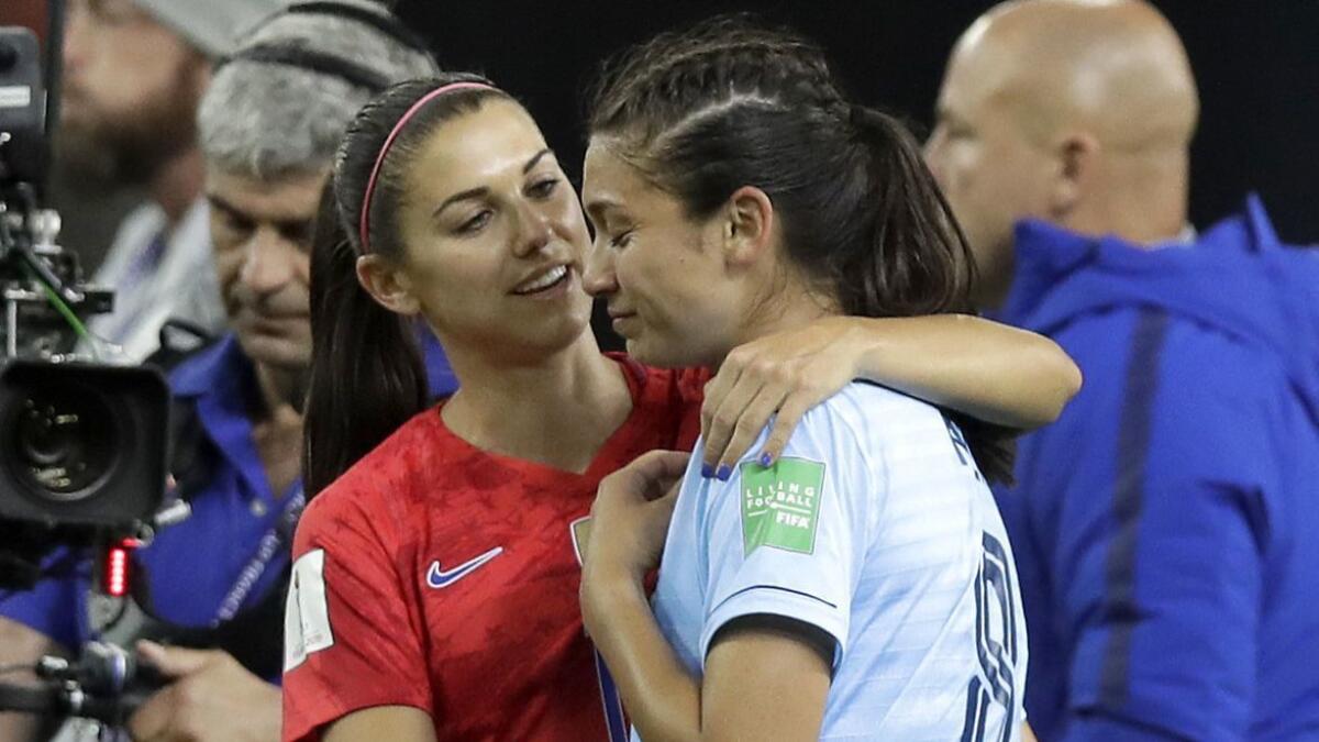United States' Alex Morgan, left, comforts Thailand's Miranda Nild after the Women's World Cup Group F soccer match between U.S. and Thailand in Reims, France on Tuesday. Morgan scored five goals during the match.