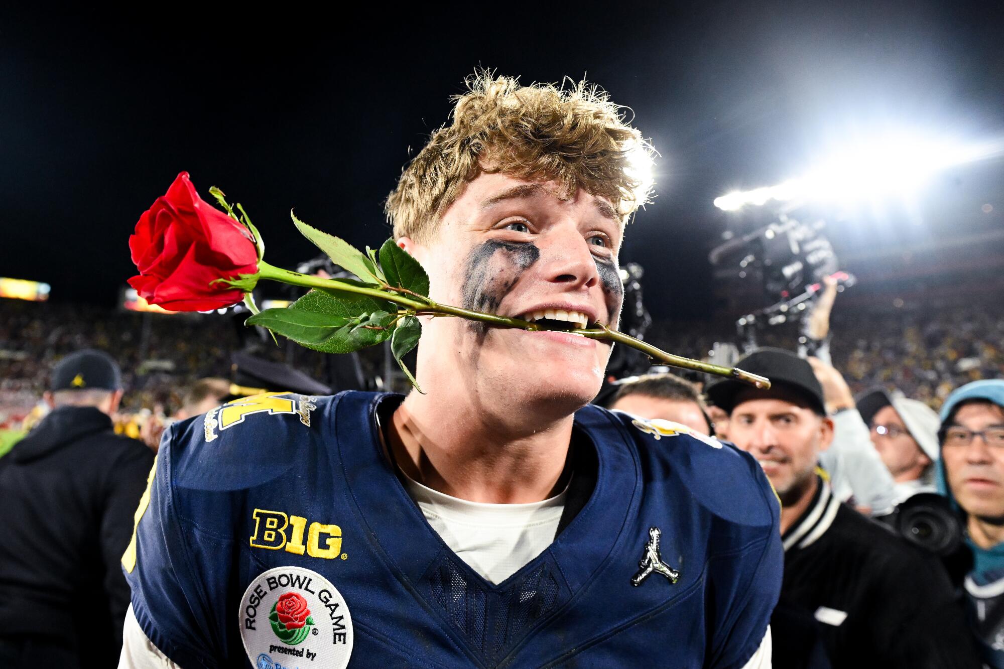 Michigan quarterback J.J. McCarthy celebrates after the Wolverines' 27-20 overtime win over Alabama in the Rose Bowl.