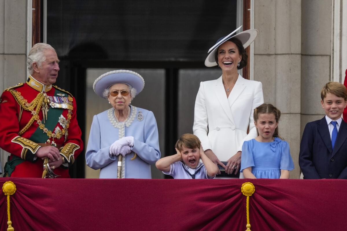 Royals young and old gather on a balcony at Buckingham Palace