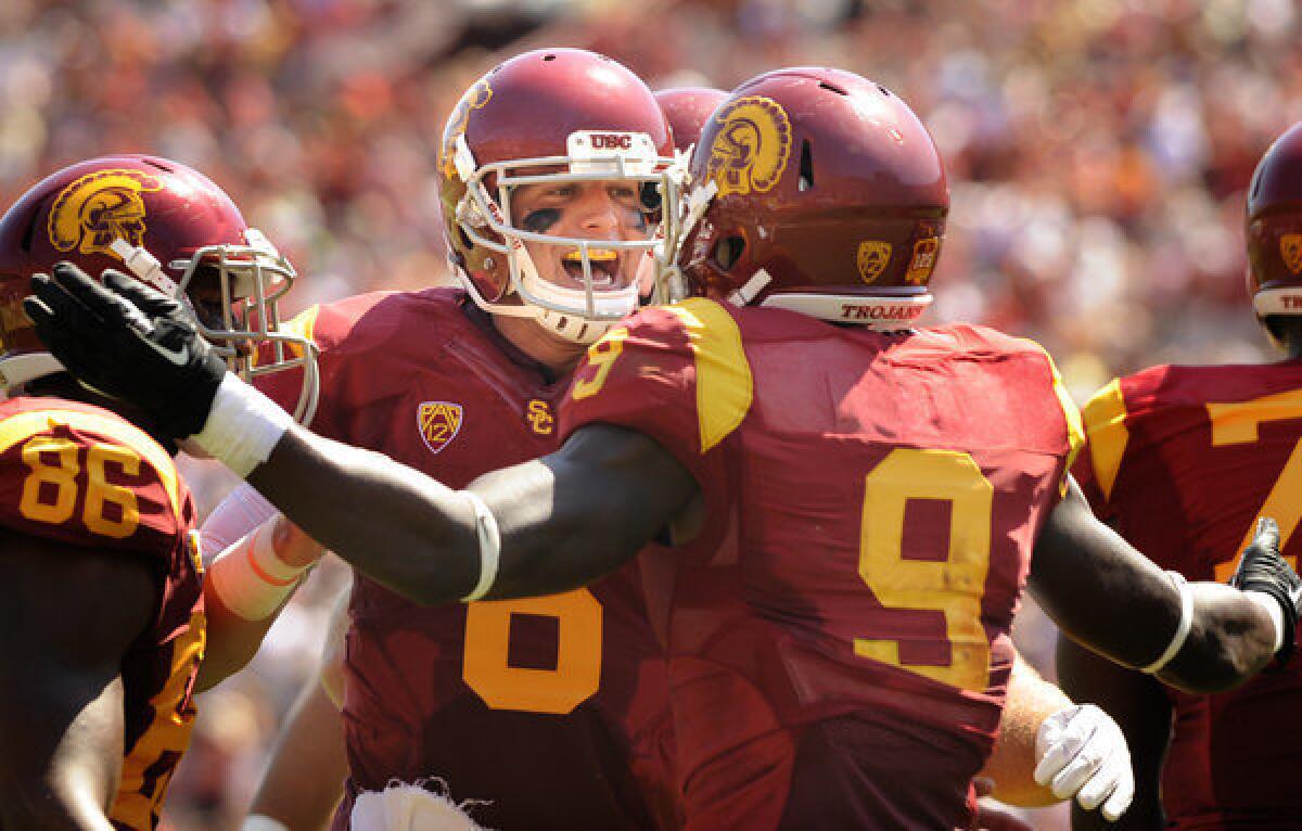 USC quarterback Cody Kessler celebrates with receiver Marqise Lee after connecting on an 80-yard touchdown against Boston College in the second quarter at the Coliseum.