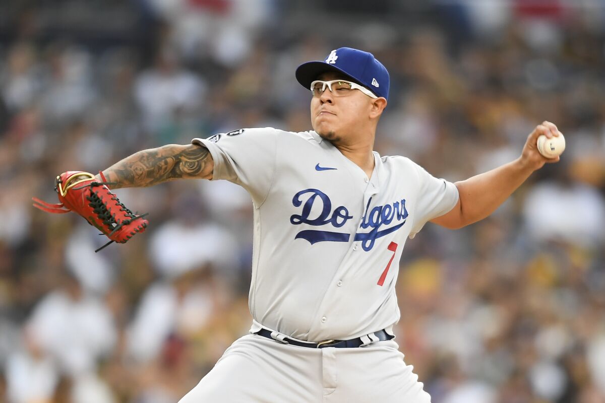 Dodgers starter Julio Urías delivers during a loss to the San Diego Padres on Monday.