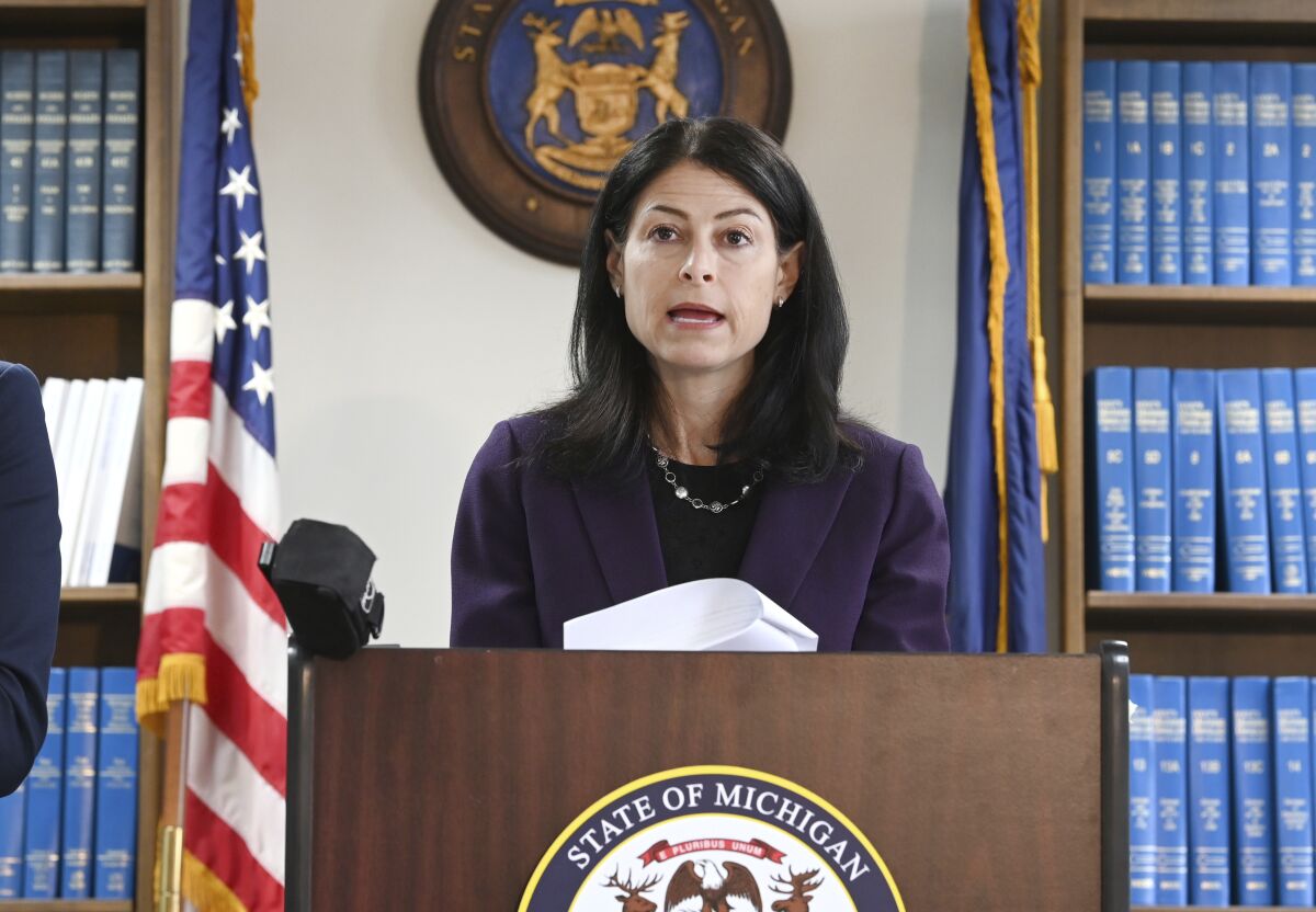 FILE - Attorney General Dana Nessel announces charges for several security guards from Northland Mall in the 2014 death of McKenzie Cochran during a news conference in Detroit on Thursday, Oct. 14, 2021. Nessel is asking federal prosecutors, Thursday, Jan. 13, 2022, to open a criminal investigation into 16 Republicans who submitted false certificates stating they were the state’s presidential electors despite Joe Biden’s 154,000-vote victory in 2020. (Max Ortiz/Detroit News via AP)