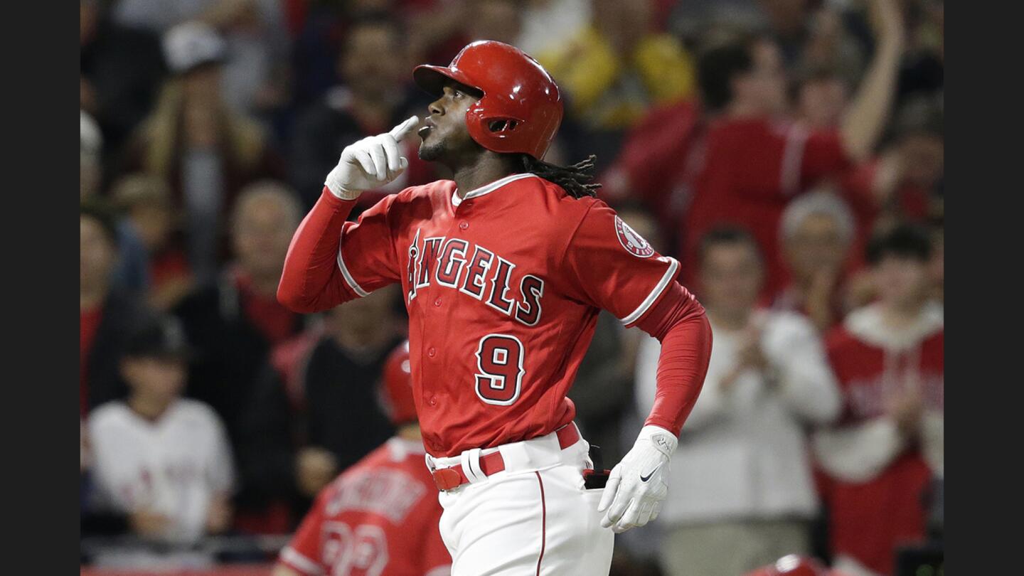 Cameron Maybin reacts after hitting a solo homer to give the Angels a 3-1 lead over the Mariners in the sixth inning of a game at Angel Stadium of Anaheim.