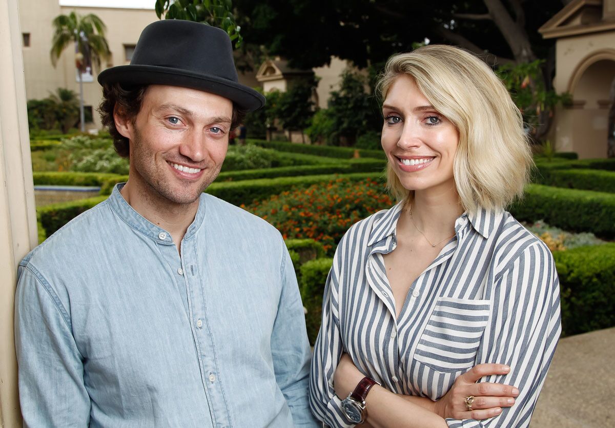 SAN DIEGO, CA August 23rd, 2017 | Writer Kirsten Guenther (right) and actor Bryce Pinkham pose for photos after a rehearsal of "Benny & Joon" in Balboa Park on Wednesday in San Diego, California. | (Eduardo Contreras / San Diego Union-Tribune)