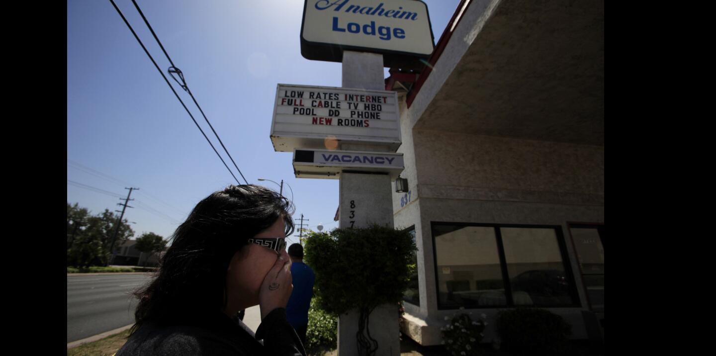 Jodi Estepp heads into the Anaheim Lodge, where her daughter, Jarrae, had checked in shortly before being found dead at a trash-sorting facility.