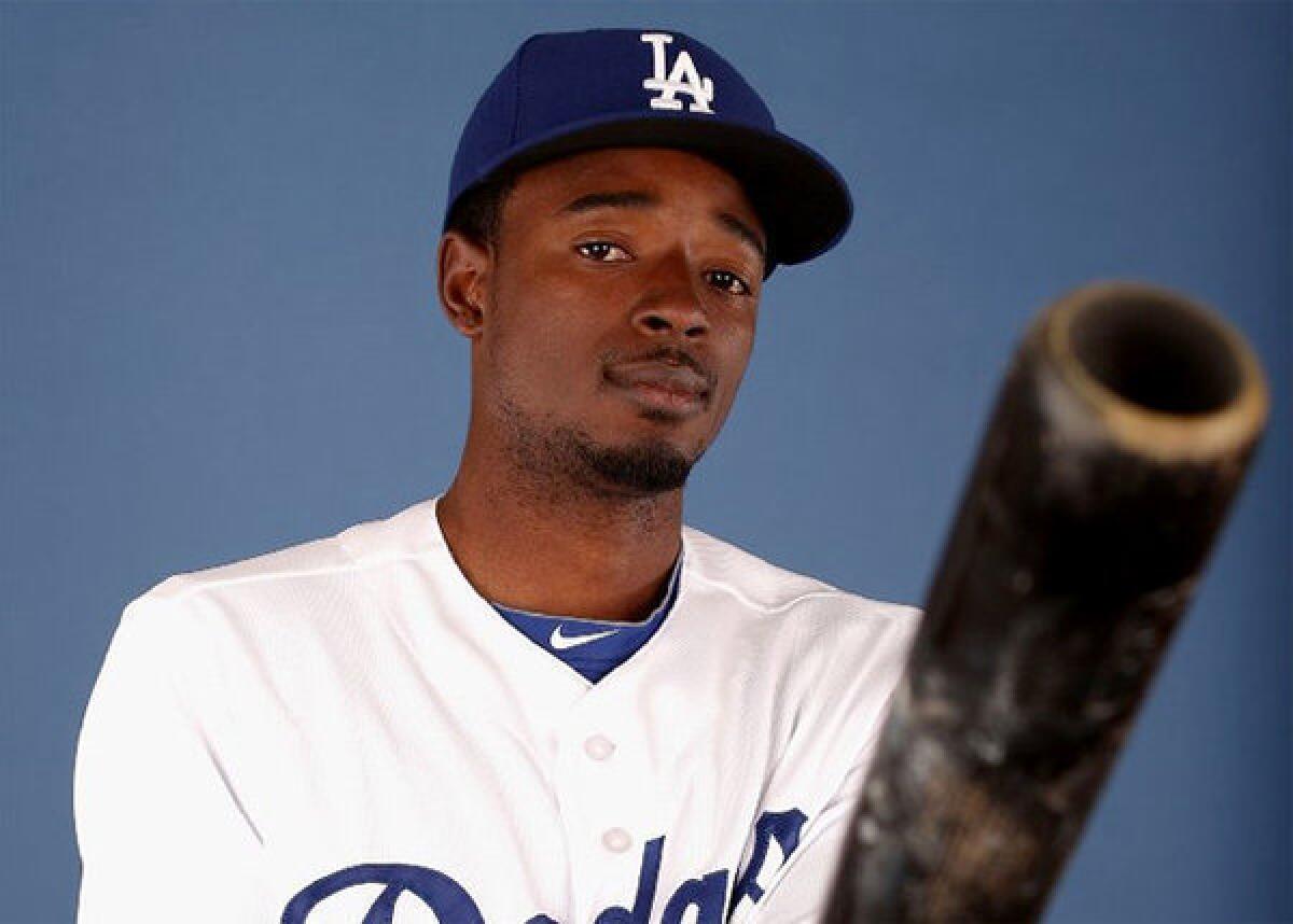 Dee Gordon poses for a portrait during spring training photo day at Camelback Ranch.