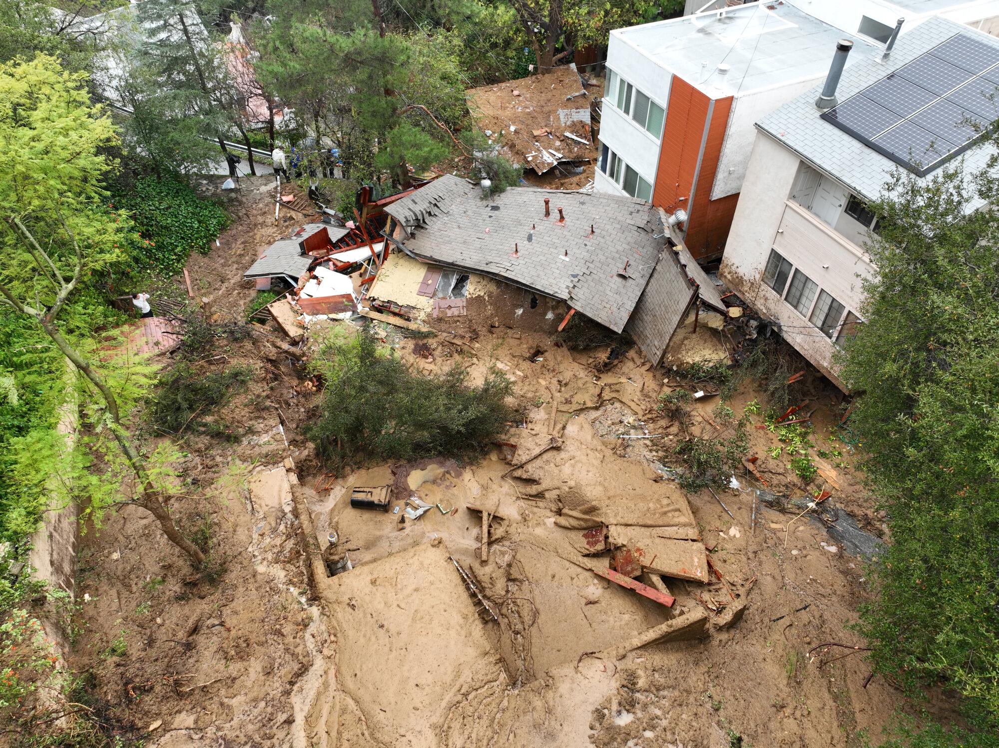 An aerial view of a Beverly Crest home that was pushed off its foundation by a mudslide early Monday morning.