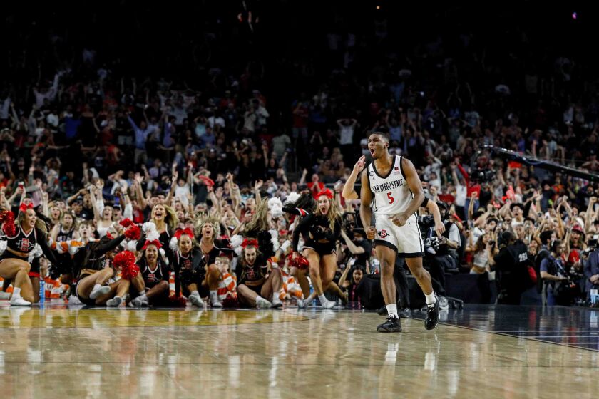 Houston, TX - April 1: San Diego State Aztecs guard Lamont Butler reacts after hitting the game-winning shot at the buzzer to head to the national championship during the semifinal round of the 2023 NCAA Men's Basketball Tournament played between the San Diego State Aztecs and the Florida Atlantic Owls at NRG Stadium on Saturday, April 1, 2023 in Houston, TX. (Meg McLaughlin / The San Diego Union-Tribune)