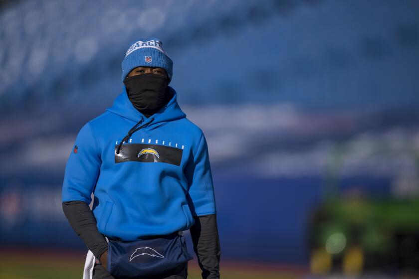 Los Angeles Chargers quarterback Tyrod Taylor (5) warms up before an NFL football game against the Buffalo Bills, Sunday, Nov. 29, 2020, in Orchard Park, N.Y. (AP Photo/Brett Carlsen)