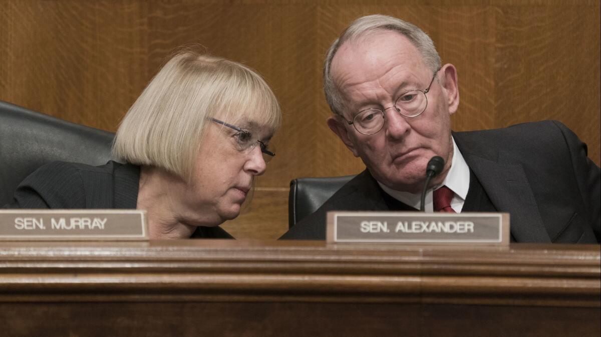 Sem. Lamar Alexander (R-Tenn.), chairman of the Senate Health, Education, Labor and Pensions Committee, right, consults with the panel's top Democrat, Patty Murray of Washington, at a hearing on healthcare in October.