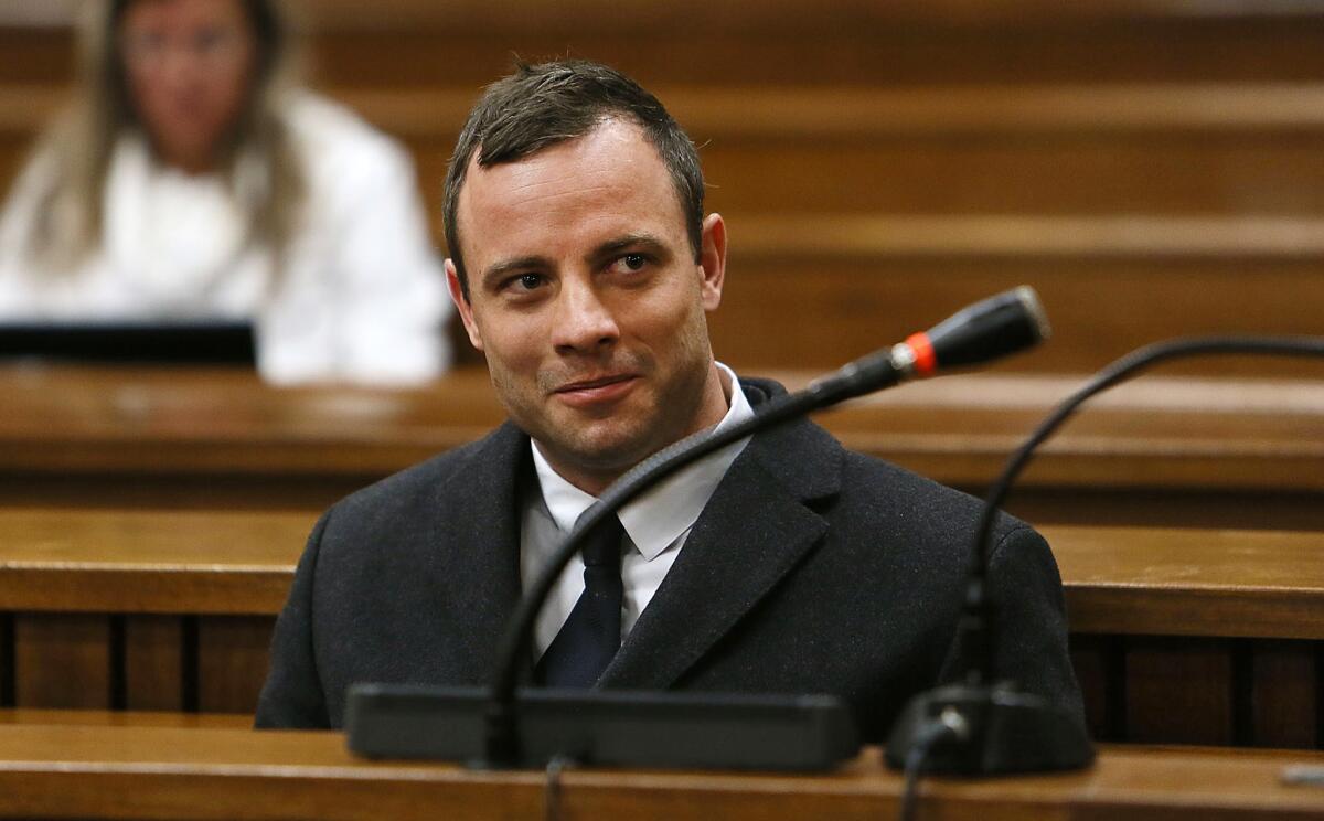 Oscar Pistorius attends court at his murder trial for the shooting death of his girlfriend Reeva Steenkamp on Valentine's Day last year. His lawyer closed his defense argument on Tuesday.