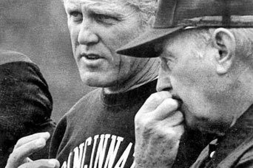 As an assistant coach with the Cincinnati Bengals, Bill Walsh, left, worked with Paul Brown, right, one of the great coaches in an an earlier era of the NFL.