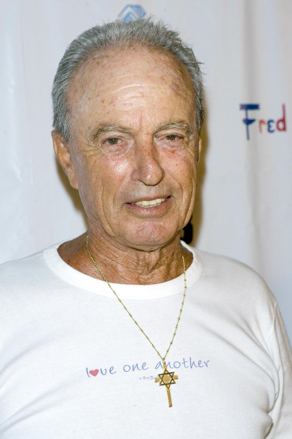 Fred Segal in a white T-shirt