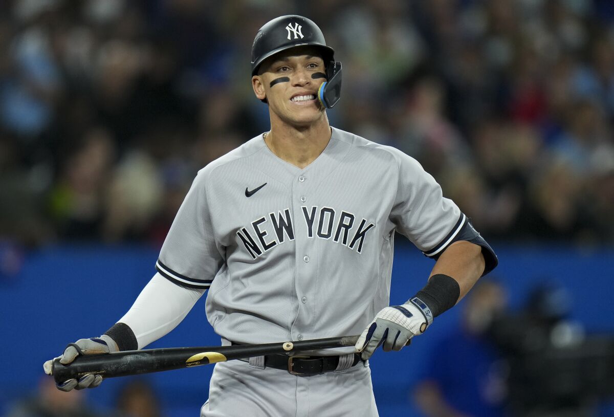 New York Yankees' Aaron Judge (99) reacts after striking out against the Toronto Blue Jays during the third inning of a baseball game Tuesday, May 3, 2022, in Toronto. (Nathan Denette/The Canadian Press via AP)