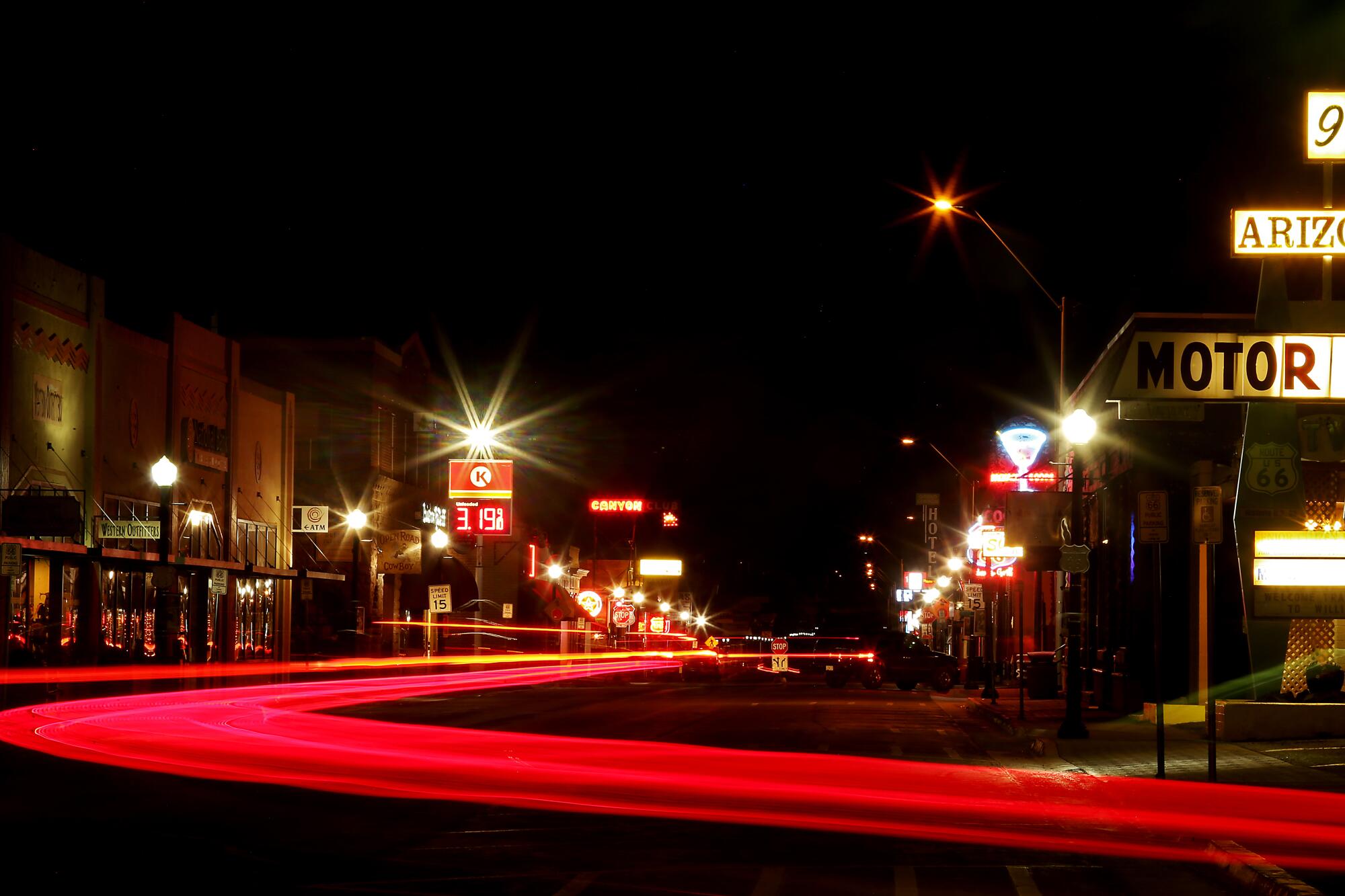 Traffic streams at night through Williams, Ariz., the gateway to the Grand Canyon. 