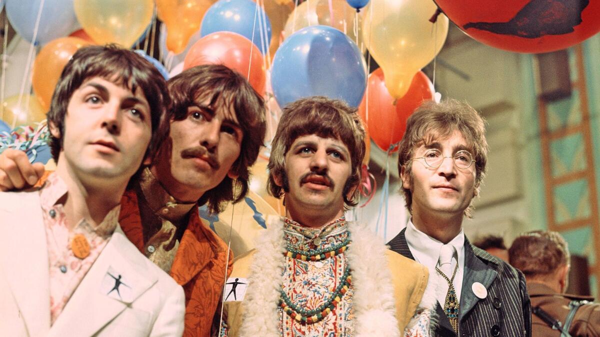 Paul McCartney, from left, George Harrison, Ringo Starr and John Lennon in June 1967. (David Magnus / REX / Shutterstock / WWD)