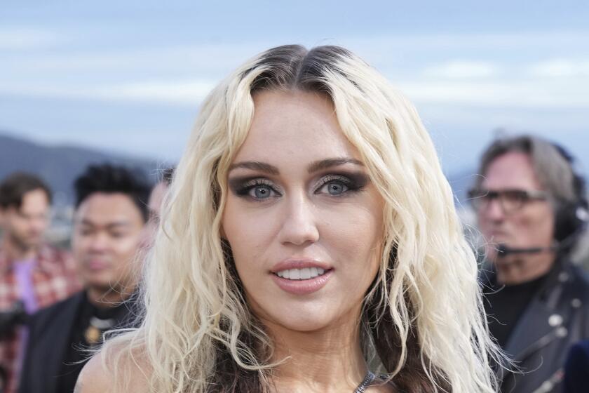 Miley Cyrus attends the Versace Fall/Winter 2023 collection is modeled on Thursday, March 9, 2023.