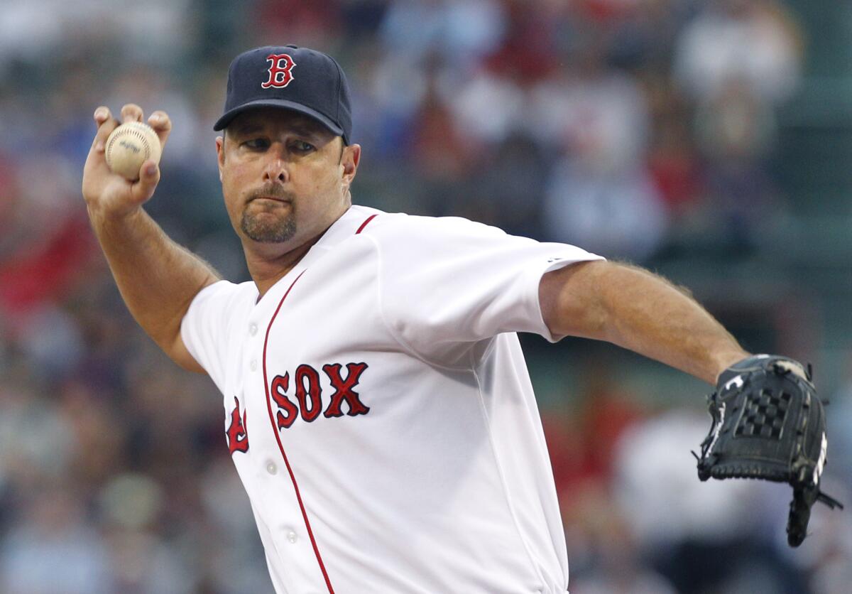 Boston Red Sox starting pitcher Tim Wakefield throws a knuckleball against the Cleveland Indians in August 2011.