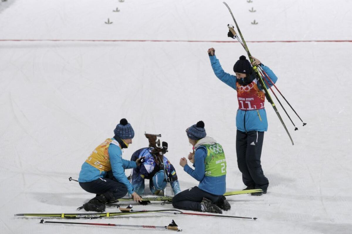 The team from Ukraine celebrates its biathlon gold.