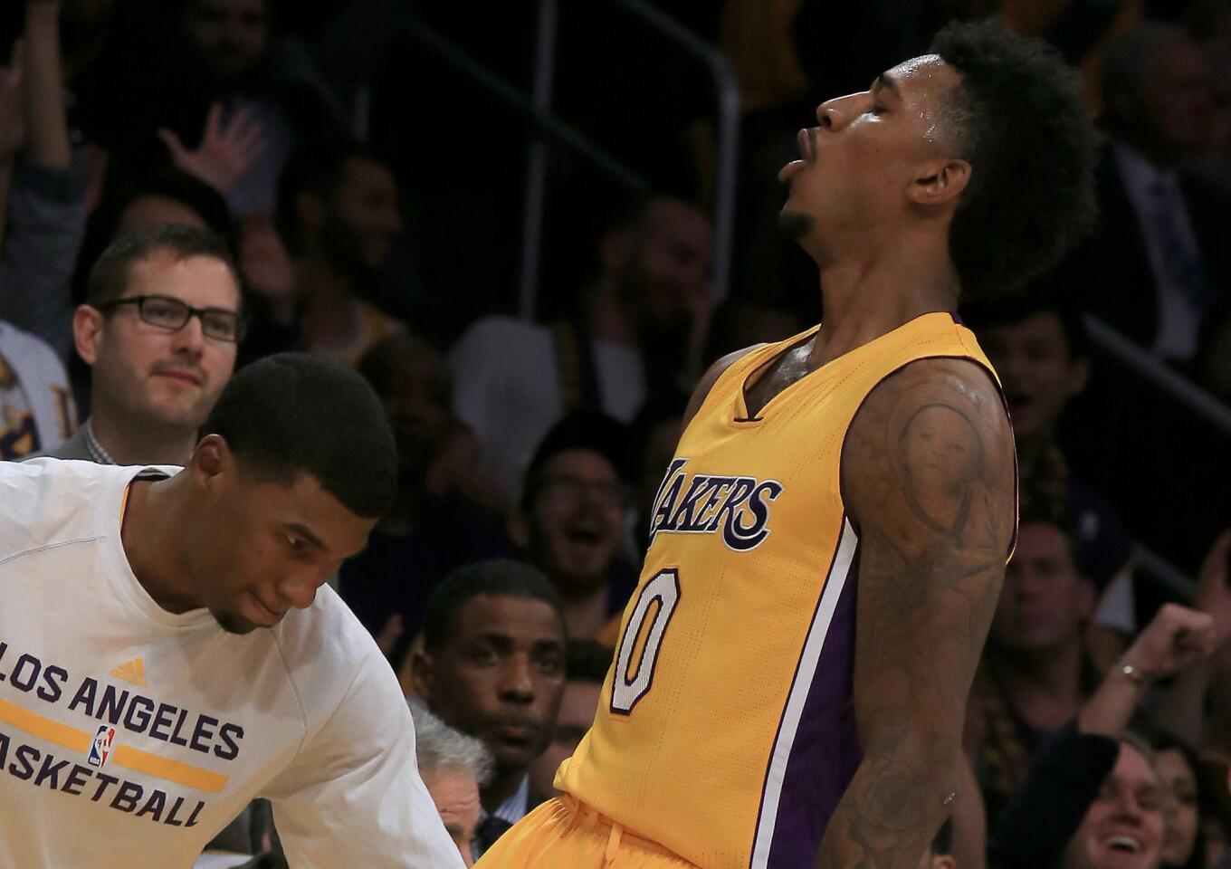 Nick Young celebrates after hitting a three during the second quarter of the Lakers' game Tuesday against the Golden State Warriors.