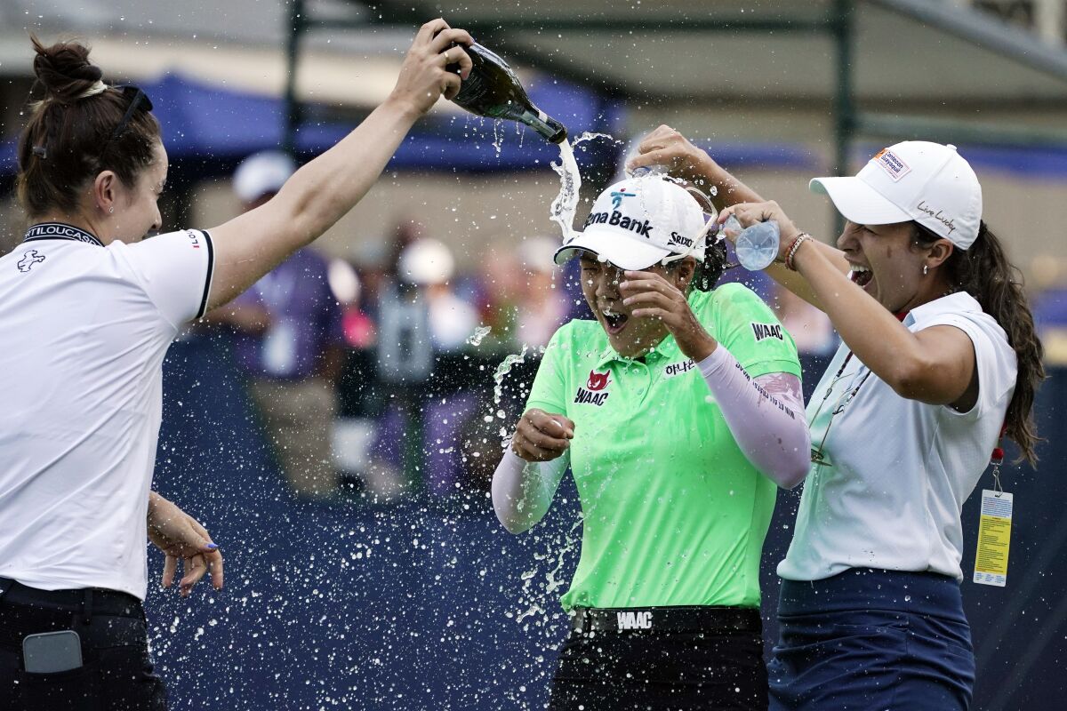 Minjee Lee, of Australia, celebrates a win after the final round of the U.S. Women's Open golf tournament at the Pine Needles Lodge & Golf Club in Southern Pines, N.C., on Sunday, June 5, 2022. Minjee Lee, of Australia, won the match. (AP Photo/Mike Stewart)