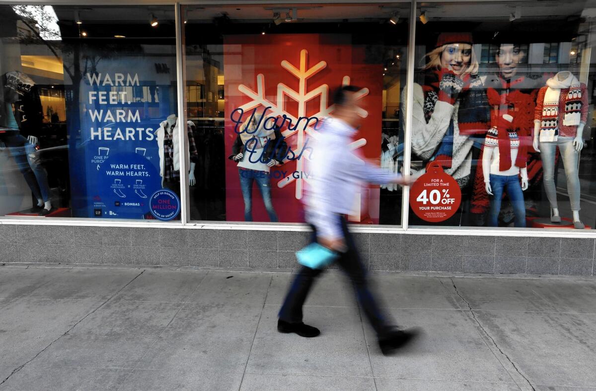 Many retailers are rolling out deals aggressively throughout November and December. Above, stores in Old Town Pasadena last week.