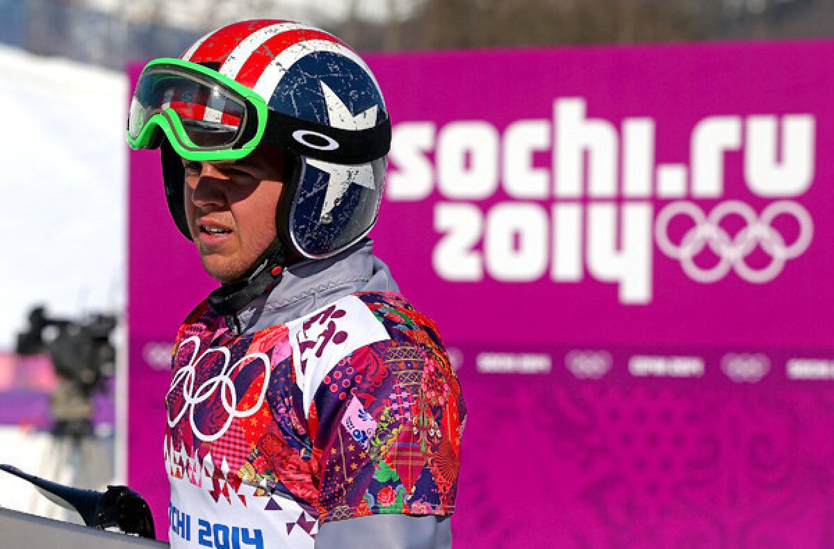 American Trevor Jacob takes a break between Sochi Olympics practice runs for the snowboard cross at the Rosa Khutor Extreme Park.