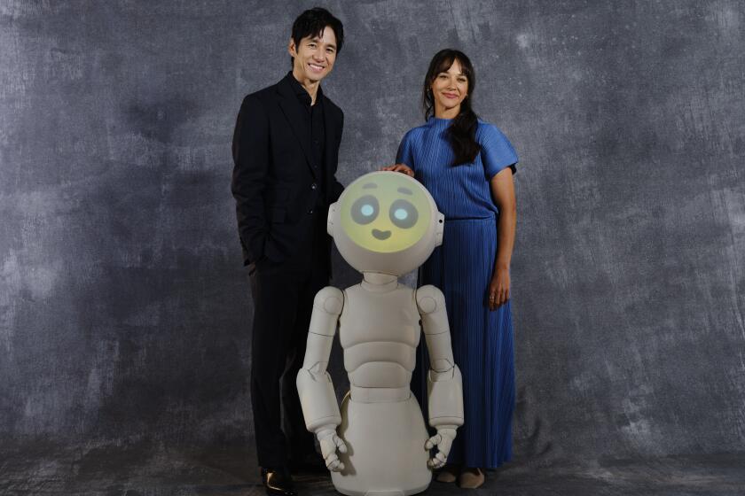 Actors Hidetoshi Nishijima, left, and Rashida Jones star in SUNNY on Apple TV+. (Credit: Yosuke Demukai)