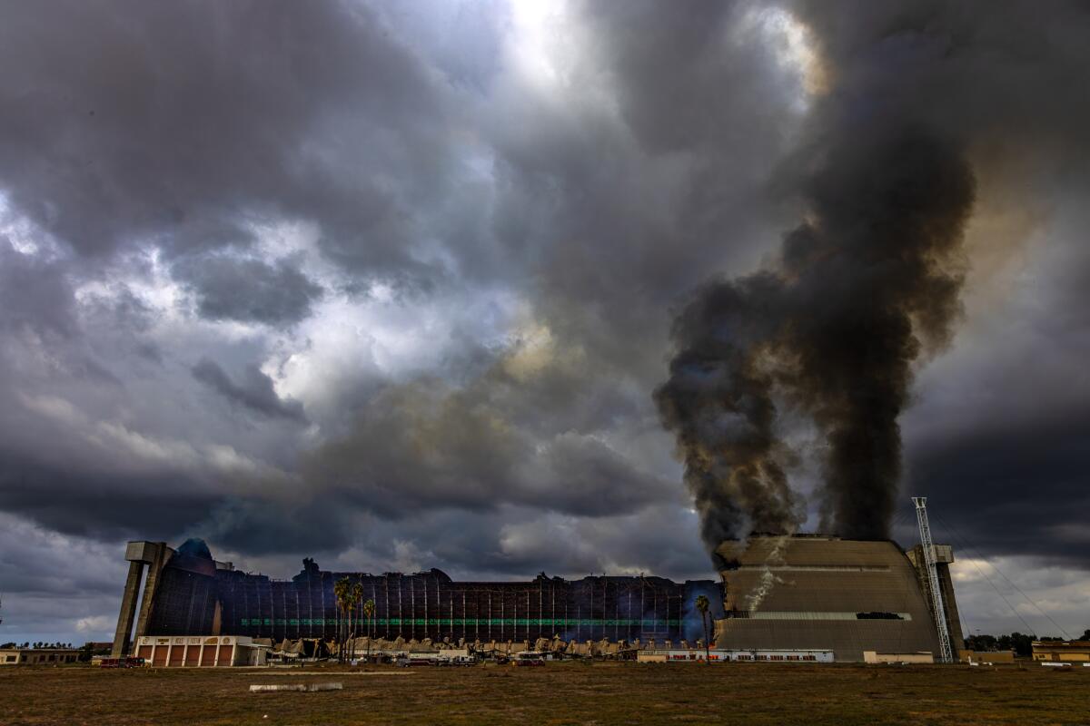 A stubborn fire burned down a hangar at the Marine Corps Air Station on Tuesday in Tustin.