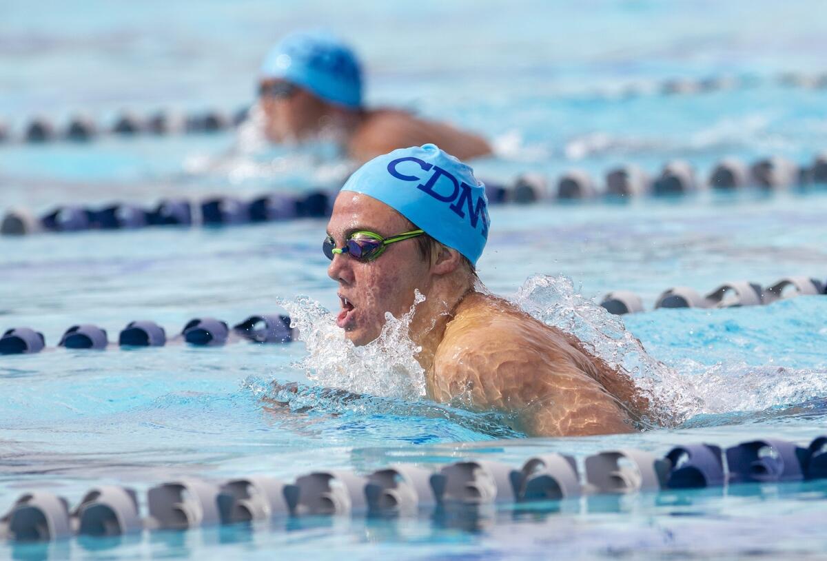 Corona del Mar High's Tanner Pulice takes first place in the boys' 200-yard individual medley during the Battle of the Bay meet at Newport Harbor on Tuesday.