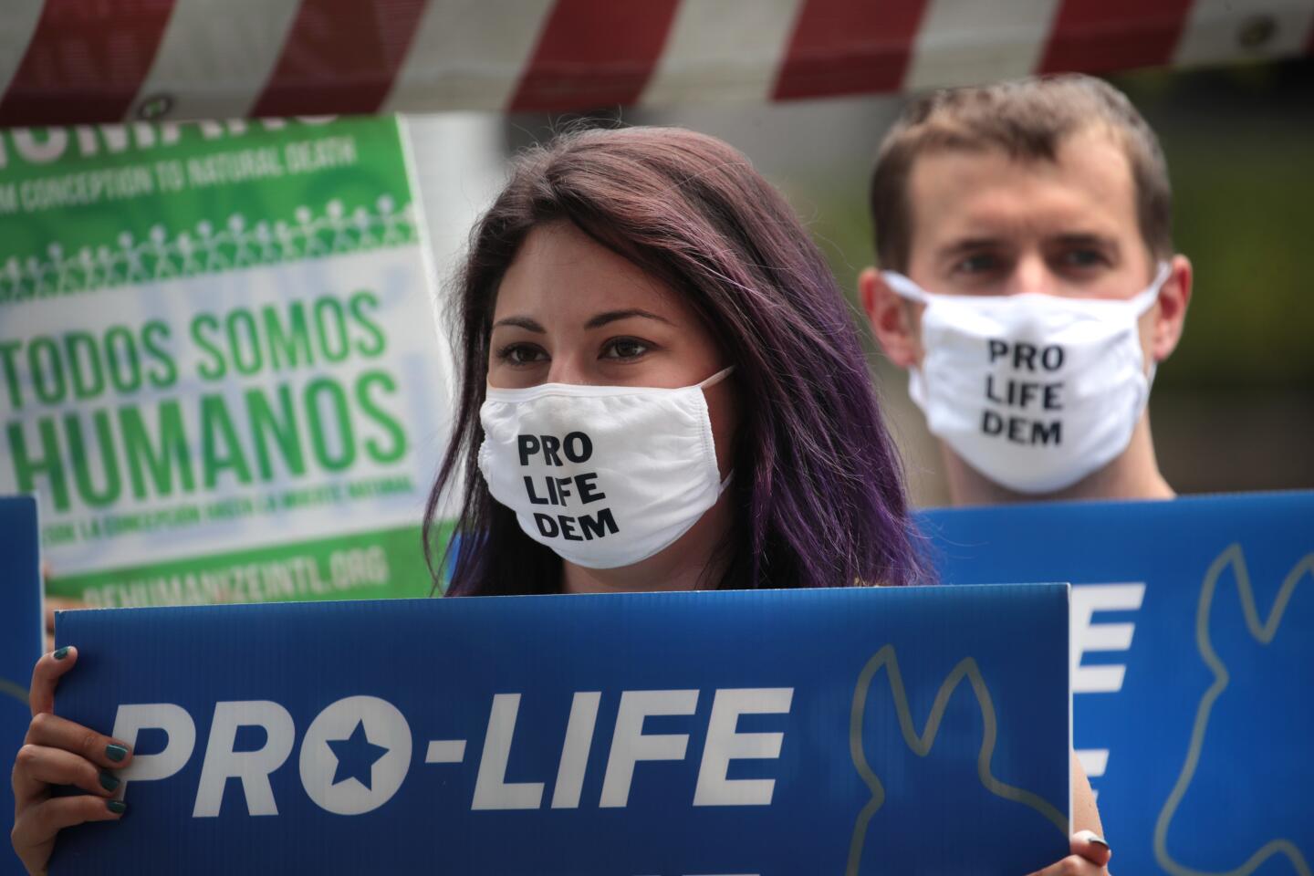 Demonstrators from Democrats for Life America protest in Zeidler Union Square near the Wisconsin Center.