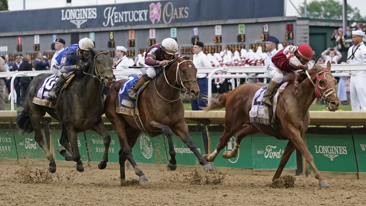 Rich Strike, right, leads Epicenter, center, and Zandon to the finish line to win the Kentucky Derby on Saturday.