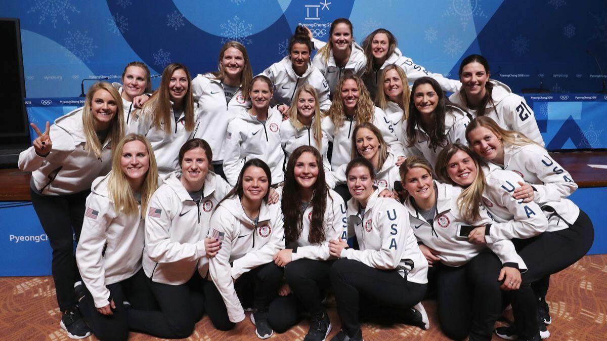 Members of the United States Women's Ice Hockey Team pose for a picture while they attend a press conference ahead of the PyeongChang 2018 Winter Olympic Games on Tuesday.