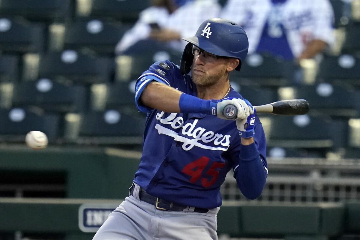 Dodgers' Matt Beaty watches an inside pitch.