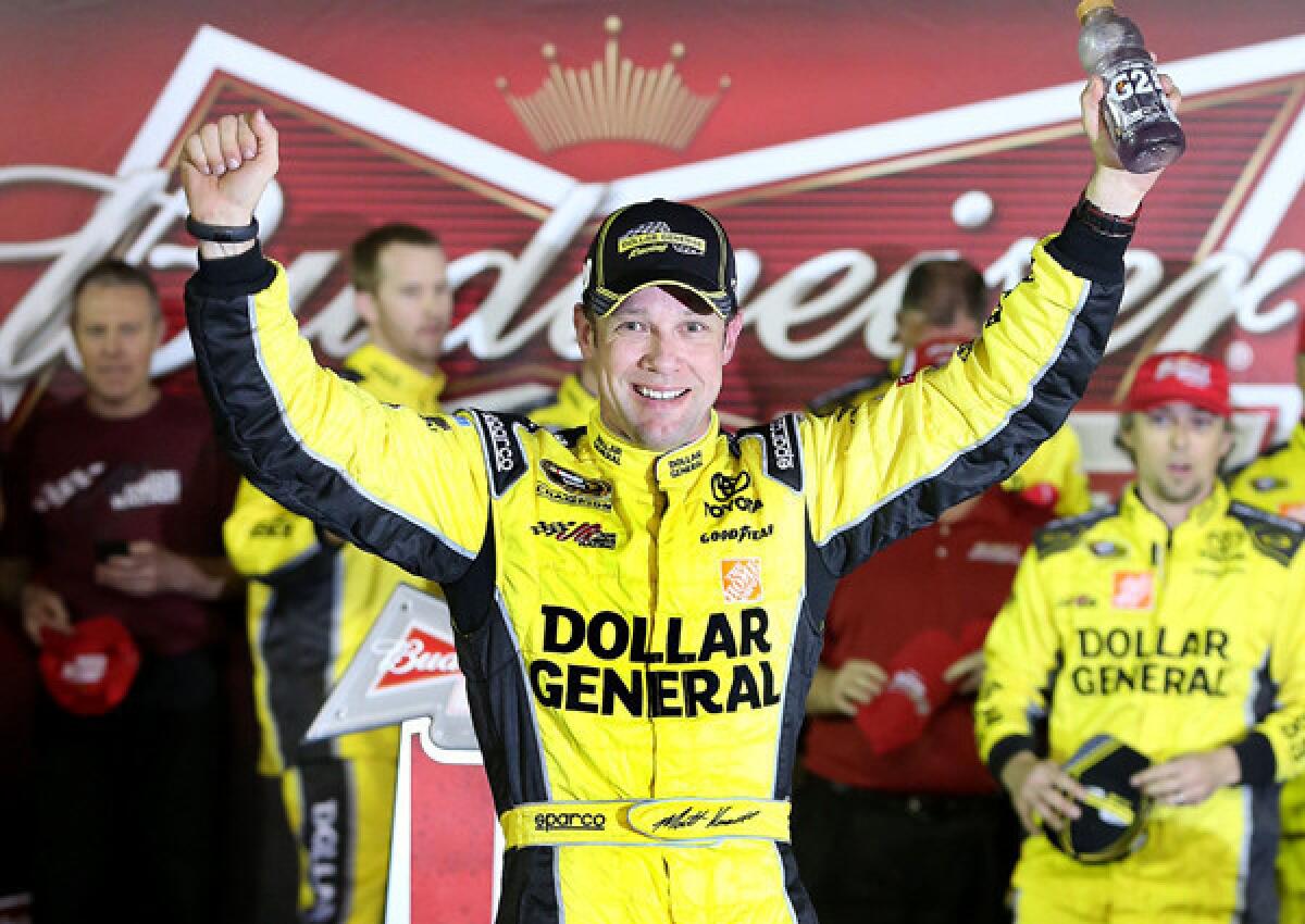 NASCAR driver Matt Kenseth celebrates his victory in the first Sprint Cup Series Budweiser 150 race on Thursday night at Daytona International Speedway.