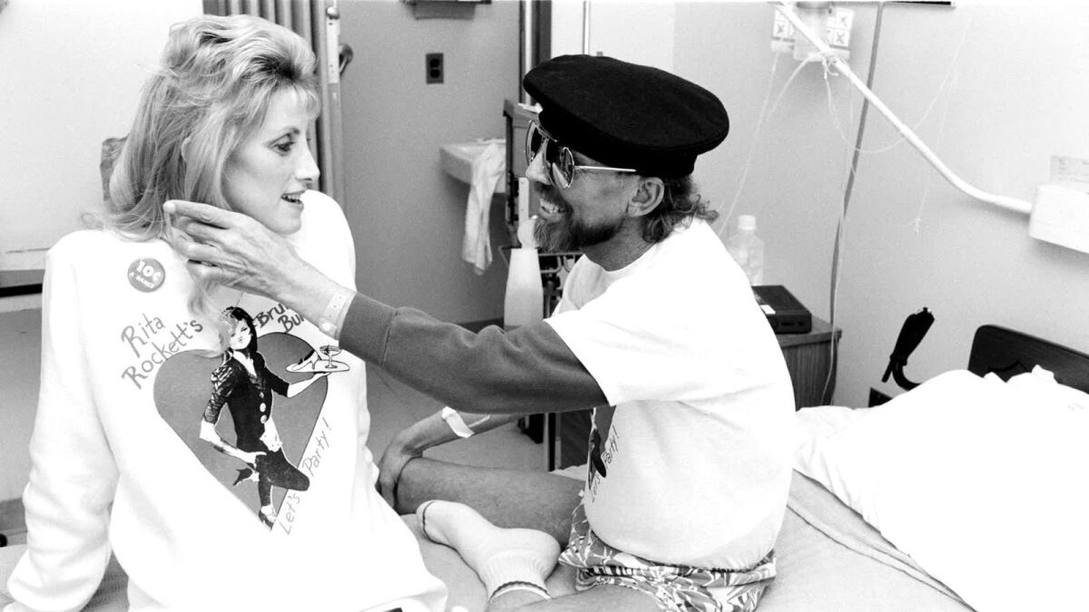 Activist Rita Rockett visits with a patient in the documentary "5B."