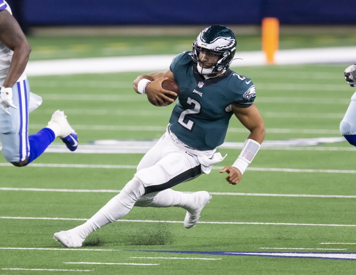 Philadelphia Eagles quarterback Jalen Hurts runs with the ball against the Dallas Cowboys on Dec. 27.