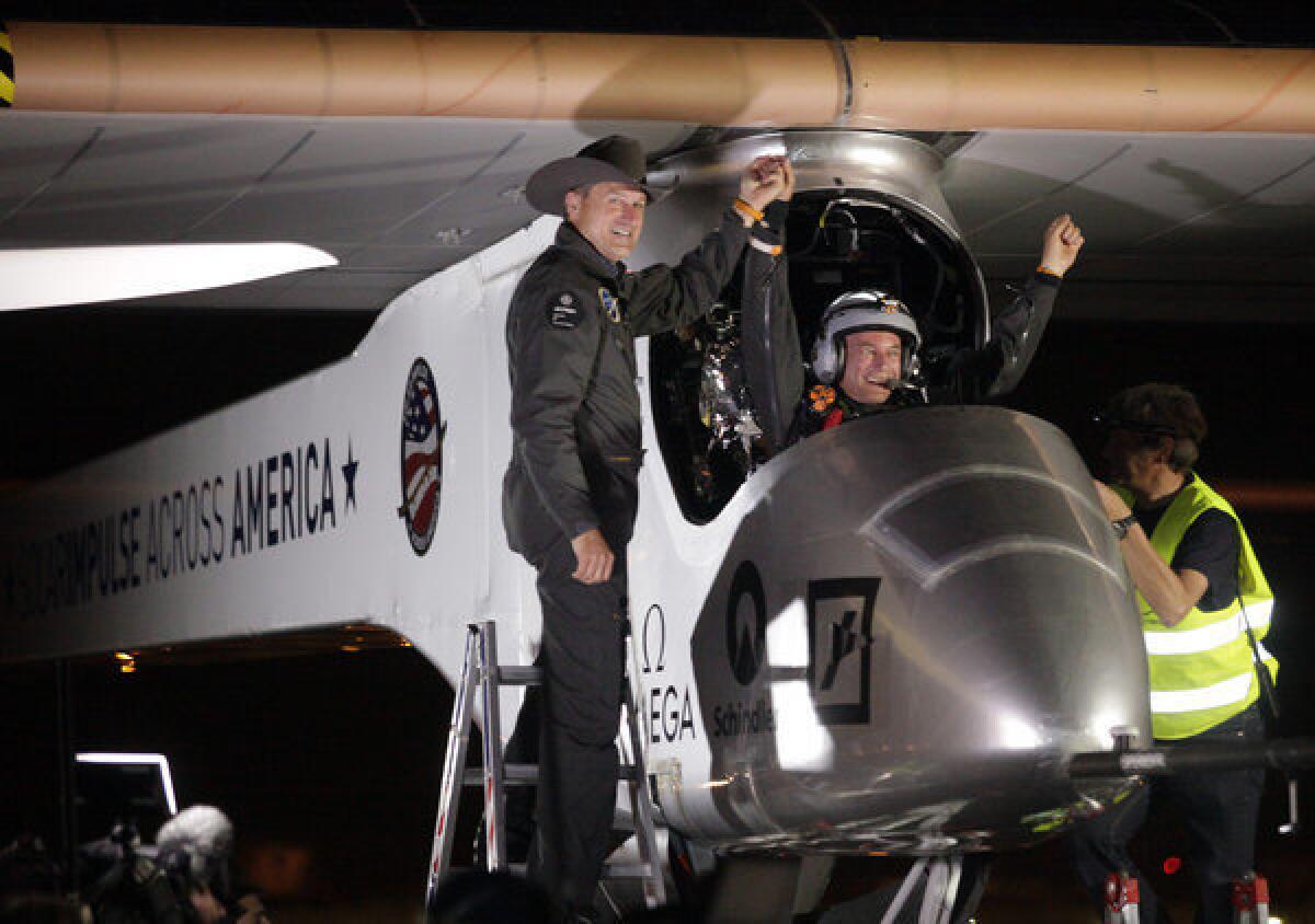 Solar Impulse co-founder and chief executive Andre Borschberg, left, greets pilot Bertrand Piccard at Sky Harbor International Airport in Phoenix early Saturday. Solar Impulse began its journey Friday in San Francisco in its attempt to reach New York.