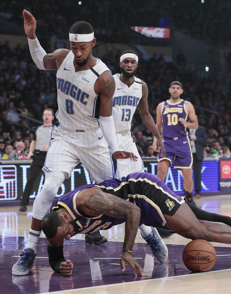 Lakers forward LeBron James tumbles to the court.
