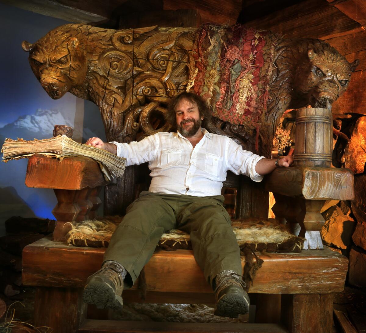 Director Peter Jackson sits in one of the giant chairs from "The Hobbit: The Desolation Of Smaug," part of a display in Beverly Hills.